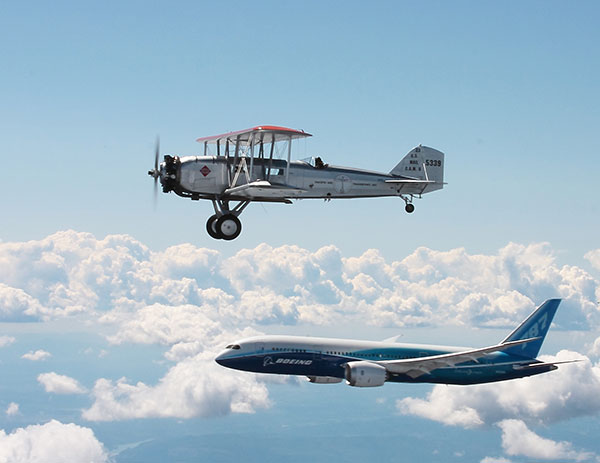 Boeing's first passenger aircraft, the Model 40, flies in formation with the Boeing 787 Dreamliner