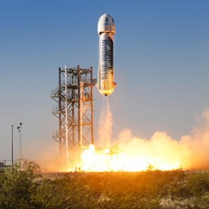 Blue origin rocket launches into space.