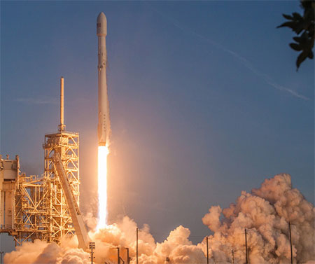 A Falcon 9 lifts off from the pad, sending Space X satellites into orbit.