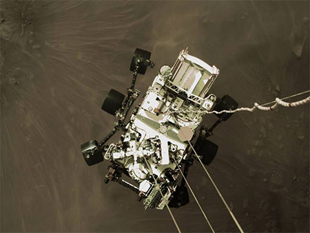 The Perseverance rover is lowered down to the surface of Mars by Aerojet thrusters.