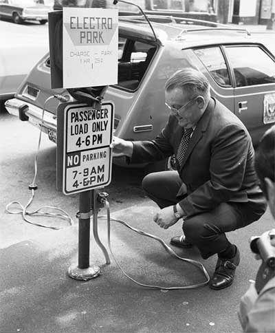 An all-electric AMC Gremlin and charging station in downtown Seattle, 1968