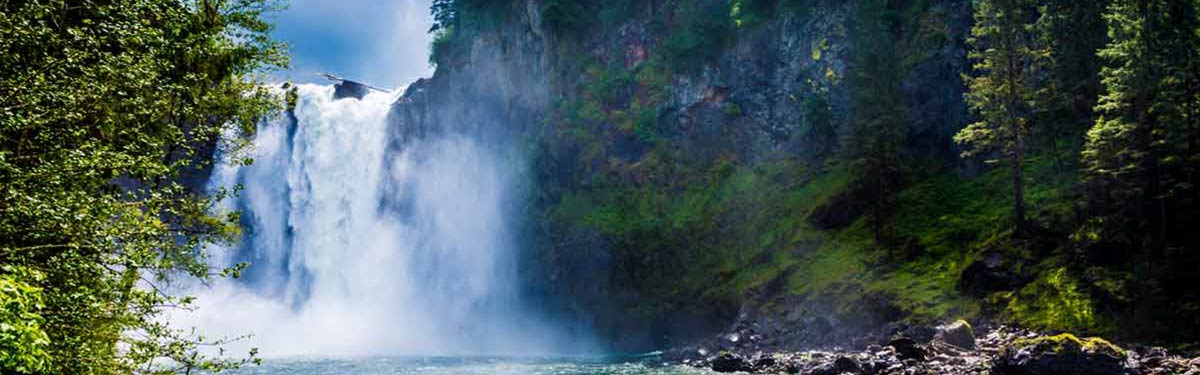 Water pours over Snoqualmie Falls, one of Washington's hydroelectric plants.