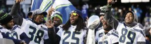 Members of the Seattle Seahawks share the Super Bowl Trophy at the celebration parade in downtown Seattle.